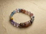 Close-up of Aquamarine and Amethyst on the bracelet, representing the Water element for communication and intuitive wisdom.