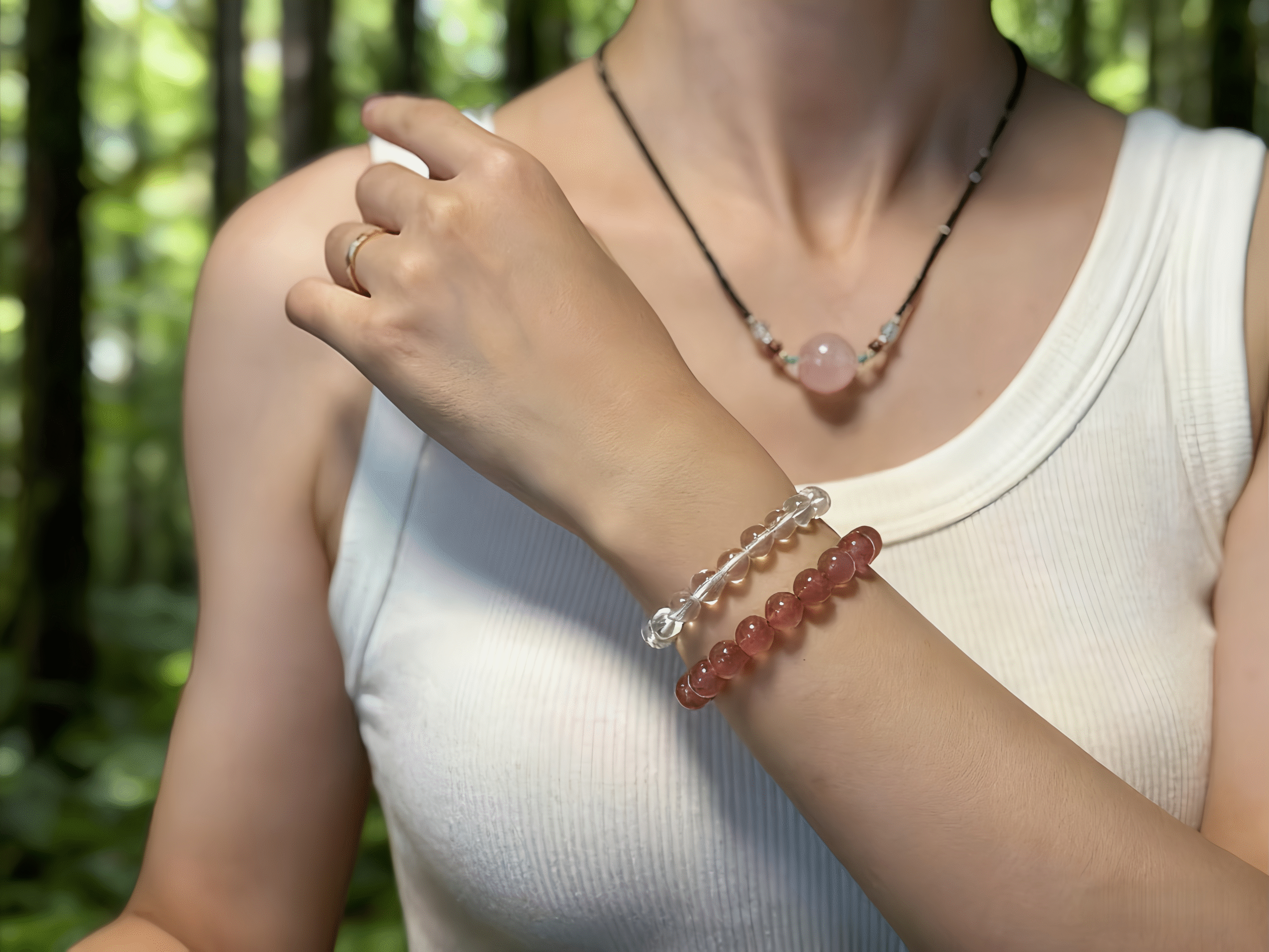 Model wearing clear quartz bracelet, showcasing elegance and energy fusion.