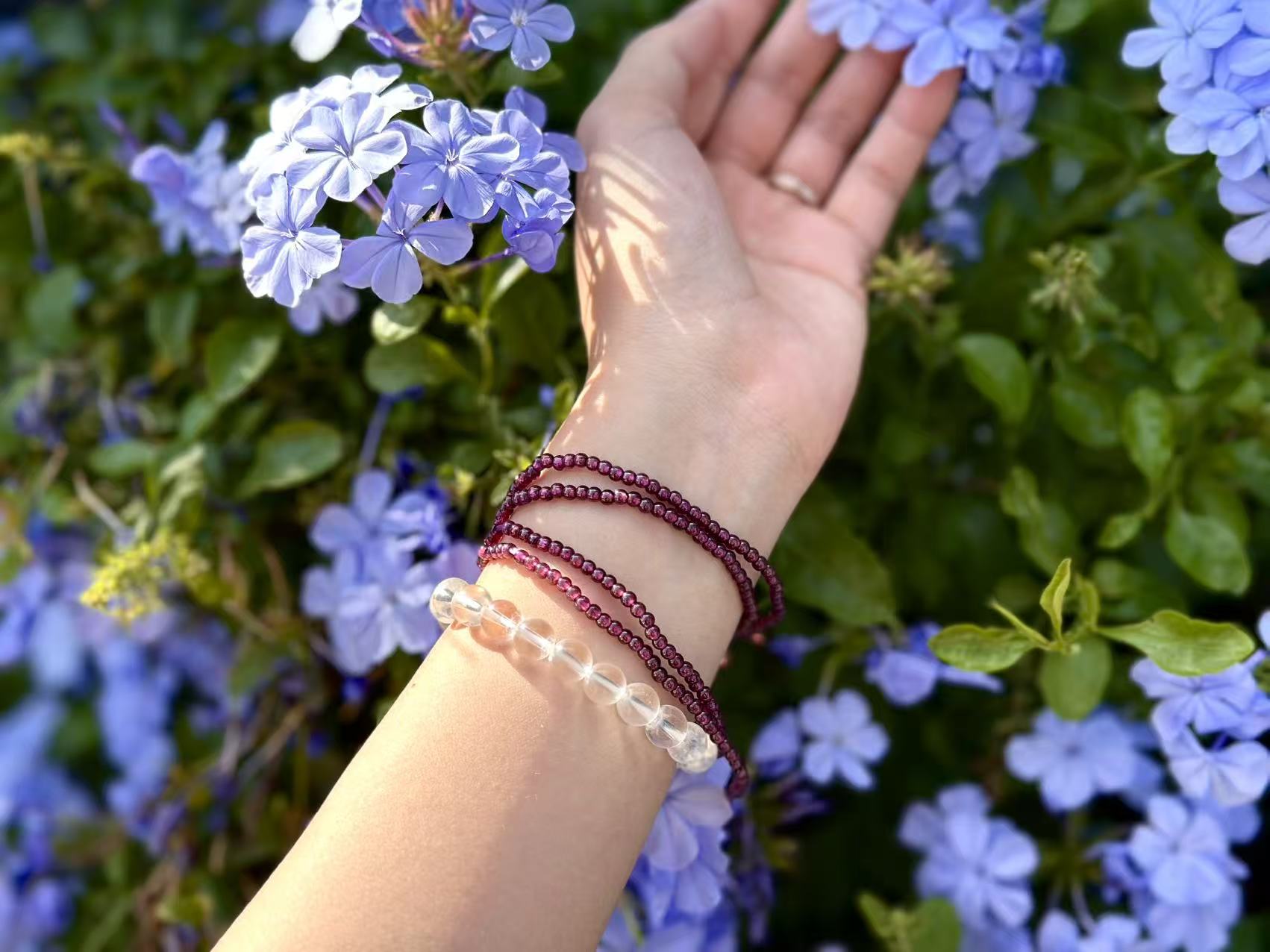Clear quartz bracelet in an office desk setting, integrated into daily life and energy