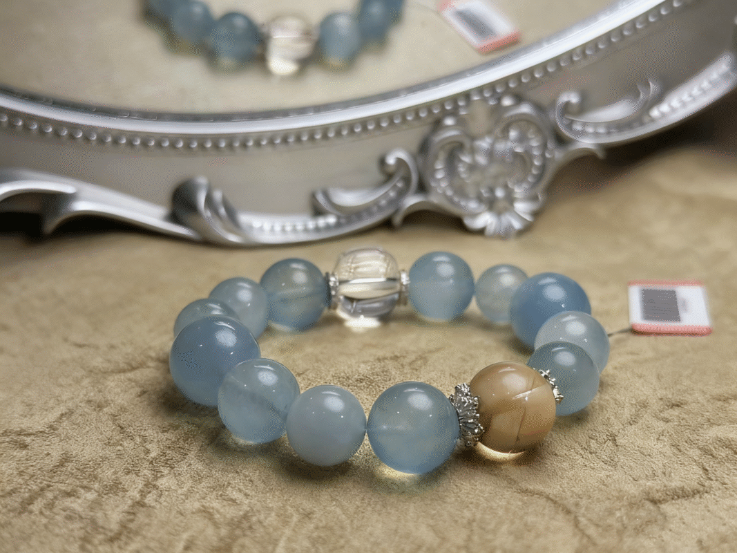 Bracelet close-up showing Aquamarine's clarity, Rutilated Quartz's inclusions, and Clear Quartz's transparency, three-color energy blending.